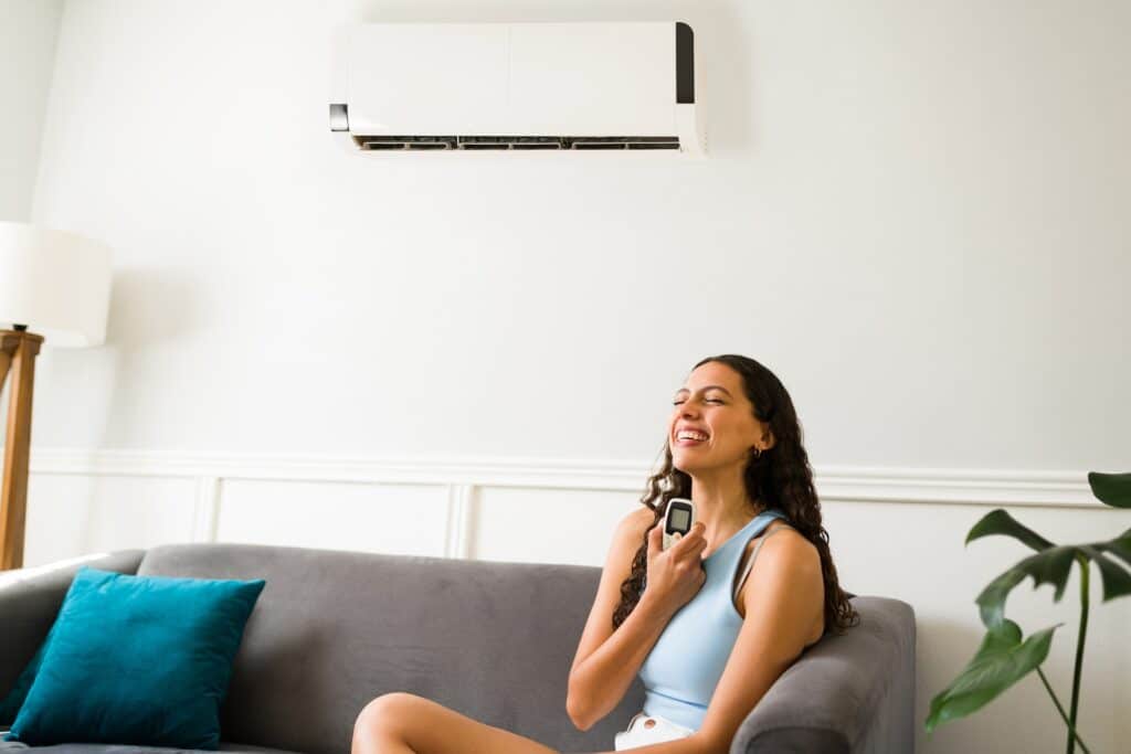 woman holding Air Condition remote